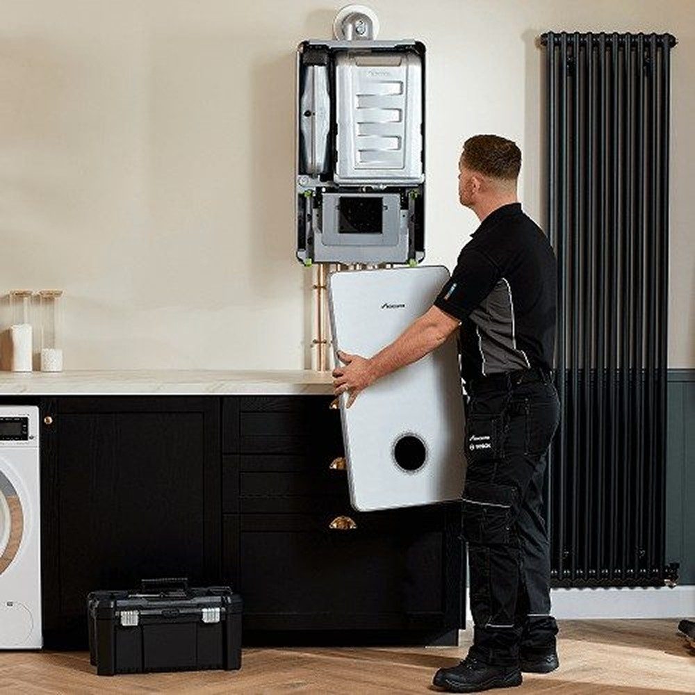 Gas Safe engineer carrying out landlord gas safety inspection on boiler in Leeds property