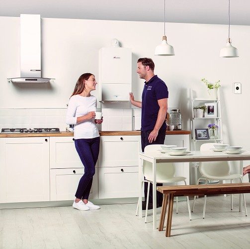 Heating engineer advising homeowner on new boiler installation in Leeds